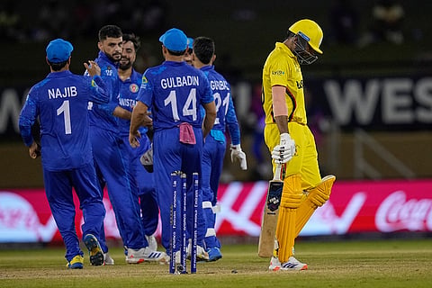 Afghanistan's players celebrate Dineshkumar Nakrani's wicket